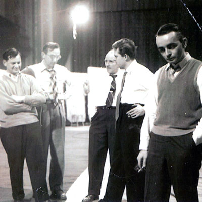 Band members listening to playback of a Sauter-Finegan recording.